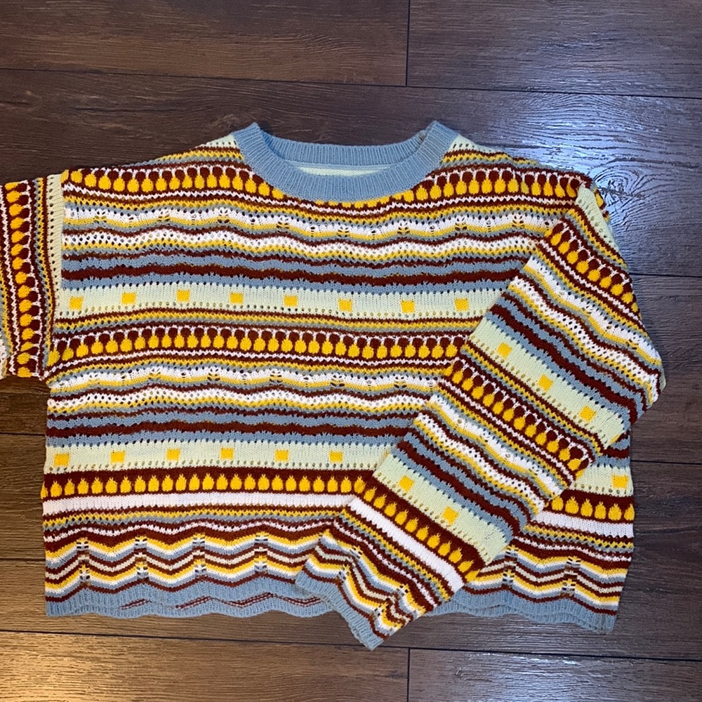 Colorful knitted sweater! Perfect for fall. Very comfy and perfect length.